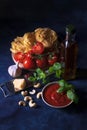 Making tomato pesto, with fresh pasta, parmesan cheese, keshu nuts, basil and olive oil Royalty Free Stock Photo