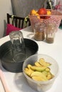 On the table are ingredients and tools for making charlotte. Autumn pie with apples