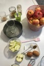 On the table are ingredients and tools for making charlotte. Autumn pie with apples