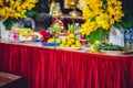 Table inside a Buddhist temple full of offerings in Vietnam