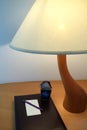 Table Lamp beside the book with Pencil Royalty Free Stock Photo