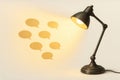 A table lamp that emits light in the form of chat bubbles. Royalty Free Stock Photo