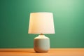 Table lamp on a green background.