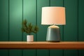 Table lamp on a green background.