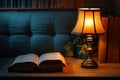 Table lamp illuminates cozy reading scene, adjacent to book