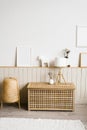 Table lamp, lavender in a white vase in the decor of the living room in a minimalist Scandinavian style. Mockup frames on the wall