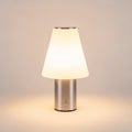 Table lamp with a minimalist design. Features a conical white Royalty Free Stock Photo