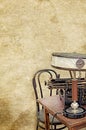 Table lamp typewriter desk chair on the old vintage textured paper background Royalty Free Stock Photo