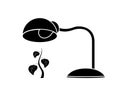 Table lamp warms a plant