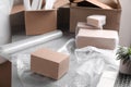 Table with laptop, boxes and bubble wrap in warehouse Royalty Free Stock Photo