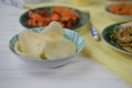 prawn crackers served on a table with traditional Chinese dishes