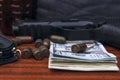 On the table lie a pistol, money, ammunition, a purse. Royalty Free Stock Photo