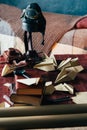 on the table lies the pilot's helmet, a toy airplane made of wood and homemade airplanes made of paper, and old books, magnifier Royalty Free Stock Photo