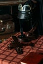 on the table lies the pilot's helmet, a toy airplane made of wood Royalty Free Stock Photo