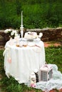 Far view on the table with long white tablecloth Royalty Free Stock Photo