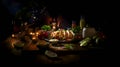 The table on it many dishes, candles, fruits, tortillas