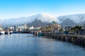 Table Mountain`s tablecloth. Natural phenomenon tablecloth clouds coming over Table Mountain. Cape Town, view from harbor Royalty Free Stock Photo