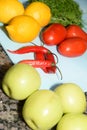 table with natural and fresh fruits apple pineapple tomato lemon Sicilian, healthy food Royalty Free Stock Photo