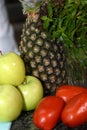 table with natural and fresh fruits apple pineapple tomato lemon Sicilian, healthy food Royalty Free Stock Photo