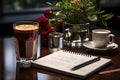 a table with a notebook and coffee and roses Royalty Free Stock Photo