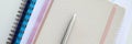 On table is notebook and silver pen closeup Royalty Free Stock Photo