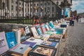 Table with old books, second hand book store on flea market in front of the Humboldt University in Berlin