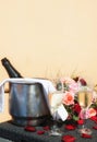 Table outside romantically set with champagne bottle on ice and full champagne flutes Royalty Free Stock Photo