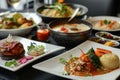 A table overflowing with a colorful array of delicious dishes, including appetizers, entrees, and desserts, ready to be