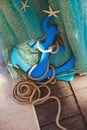 Table for painting on-site ceremony in a marine style. Decorated with nets, shells, anchor and helm. Royalty Free Stock Photo