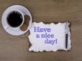On the table a piece of paper and text. Have a nice day! Royalty Free Stock Photo