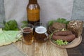 A bottle of beer, chips and sausage. Royalty Free Stock Photo