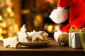 Table with prepared cookies and Christmas decoration homey living room