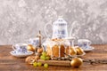 A table prepared for Easter. Easter tea drinking. Delicious home Russian cake with raisins and nuts and eggs painted in gold. Vint Royalty Free Stock Photo