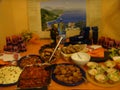 Table prepared with a lot mediterranean food in Italy.