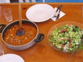 Prepared table with dishes of colored salad and meat with sauce in Turkey.