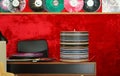 A table for QC a vinyl records with a shelf in a red room with a red wall Royalty Free Stock Photo