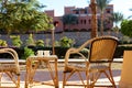 Table and rattan wicker seat chair. Wicker furniture rattan table two chairs near the window on balcony. empty chair at Royalty Free Stock Photo