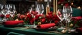 A table with red flowers and glasses Royalty Free Stock Photo