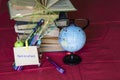 School supplies and a globe with glasses. Royalty Free Stock Photo