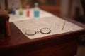 The table of the reenactor of ancient icons in the center of his old glasses Royalty Free Stock Photo