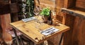 Table in the restaurant with glasses of wine and serving.