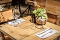 Table in the restaurant in the open air with glasses of wine.