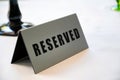 Table at restaurant with reserved sign close-up Royalty Free Stock Photo