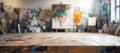 A table in a room with a lot of paintings on the wall Royalty Free Stock Photo