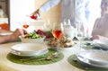 Table with rose wine, fish soup, salad and chiken Royalty Free Stock Photo