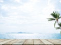 Table on Sea and Blue Sky Background,Deck Product Summer Cosmetic,Wood on Water Ocean at Coast wit Palm Tree,Board Tropical Nature Royalty Free Stock Photo