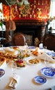 Table served with appetizers, plates with a blue pattern and glasses for wine.