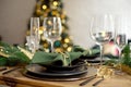 Table served for Christmas dinner in living room, close-up view, table setting, Christmas decoration Royalty Free Stock Photo