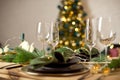 Table served for Christmas dinner in living room, close-up view, table setting, Christmas decoration. Royalty Free Stock Photo