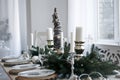 Table served for Christmas dinner in living room Royalty Free Stock Photo